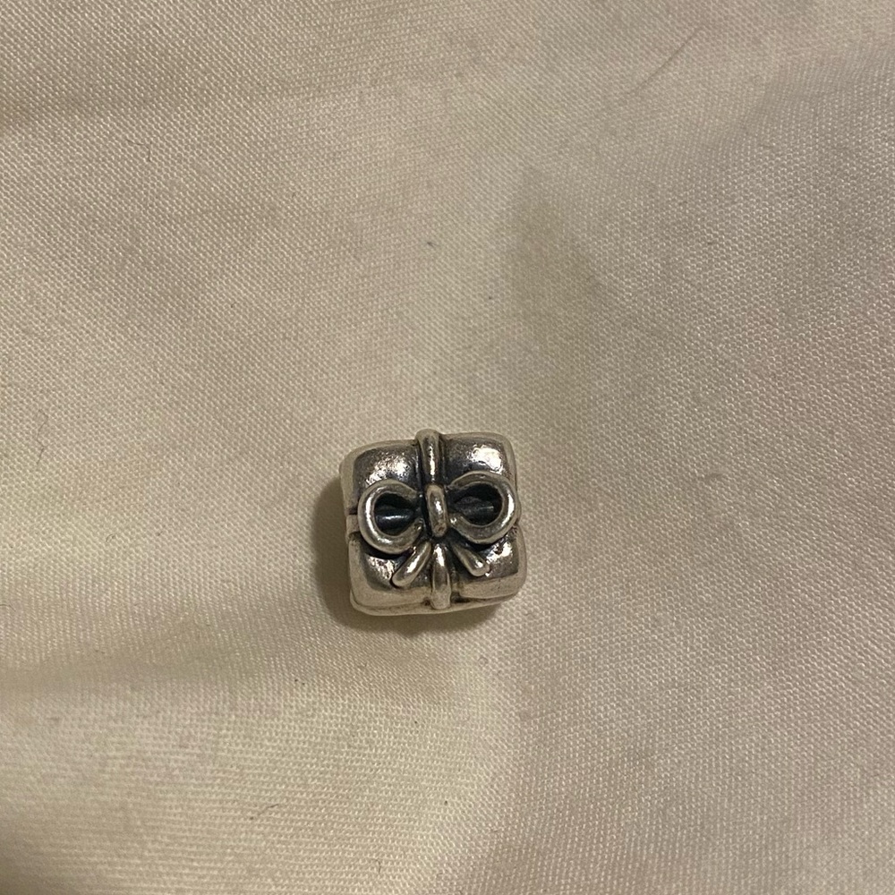 Pandora retired present silver charm